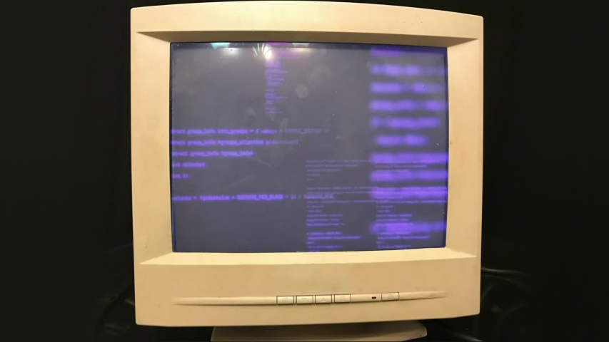 Hacking a vintage old vintage TV or computer monitor screen 80s 90s style. Glitches on screen monitor. Abstract source code data flow. Purple and blue text. screen noise. VHS style. Old kinescope Royalty-Free Stock Footage #1048021576