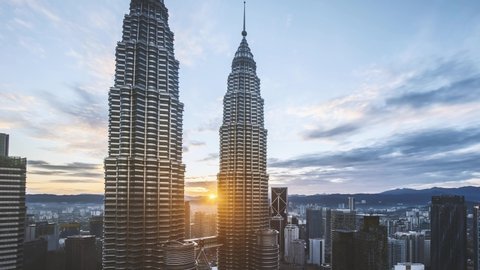 Kuala Lumpur, Malaysia - October 27, 2019: 4k time lapse of sunset at Kuala Lumpur capital city centre, Petronas Twin Towers KLCC. Zoom in