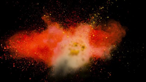 Colored orange powder explosion, abstract close up dust isolated on black background in slow motion