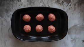 Plate of Raw Meatballs Ready for the Oven