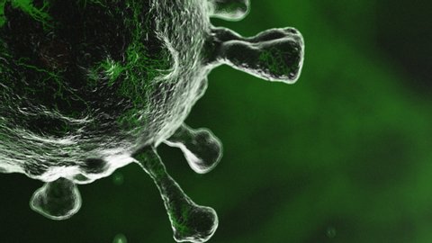 CGI close up of mutating virus cell pulsating against green background
