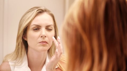 Beauty Portrait Of Woman Touching Her Beautiful Face In Slow Motion Skincare Concept. Skin care is a routine daily procedure in many settings, such as skin that is too dry.