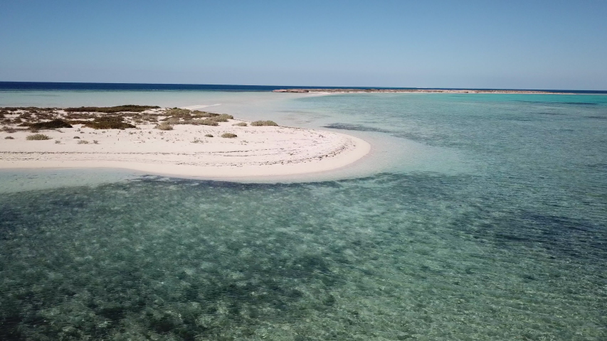 Slow drone flight over beaches of protected Umluj island group in the Red Sea in Saudi Arabia
 Royalty-Free Stock Footage #1048061890