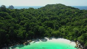 Aerial view of ocean waves, beach and rocky coastline and beautiful forest. Nga Khin Nyo Gyee Island Myanmar