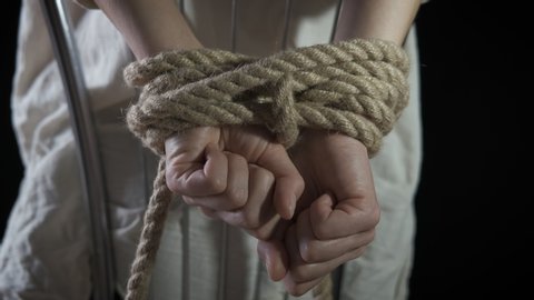 Kidnapping. Tied hands of a woman.
