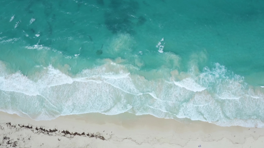 Tropical waves on a white sand beach: 4K Aerial drone footage	 | Shutterstock HD Video #1048092931