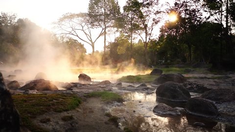 Hot Springs Onsen Natural Bath at National Park Chae Son, Lampang Thailand.In the morning sunrise.Natural hot spring bath surrounded by mountains in northern Thailand.soft focus.