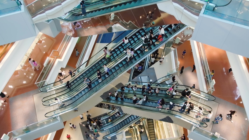 Time lapse crowded people in shopping mall. Escalators in modern shopping mall. Royalty-Free Stock Footage #1048102057