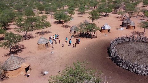 Drone footage of a village of people Himba during tourist visit, Namibia