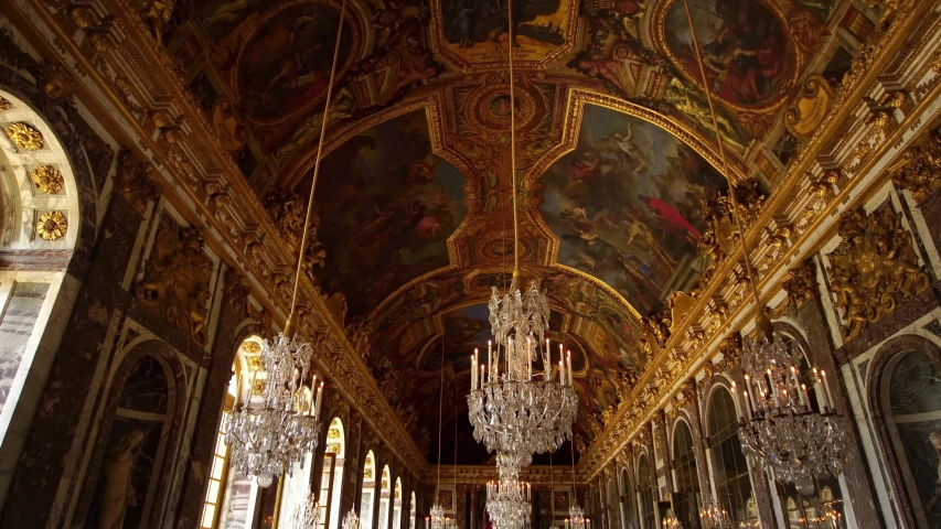VERSAILLES, PARIS, FRANCE- February 12, 2020: Chandeliers in Hall of Mirrors, Palace of Versailles, Paris. Popular tourists attraction. Famous royal history landmark. 