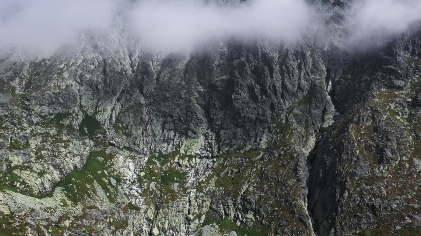 Aerial flight inside the Clouds at peaks in High Tatras Mountains in Slovakia