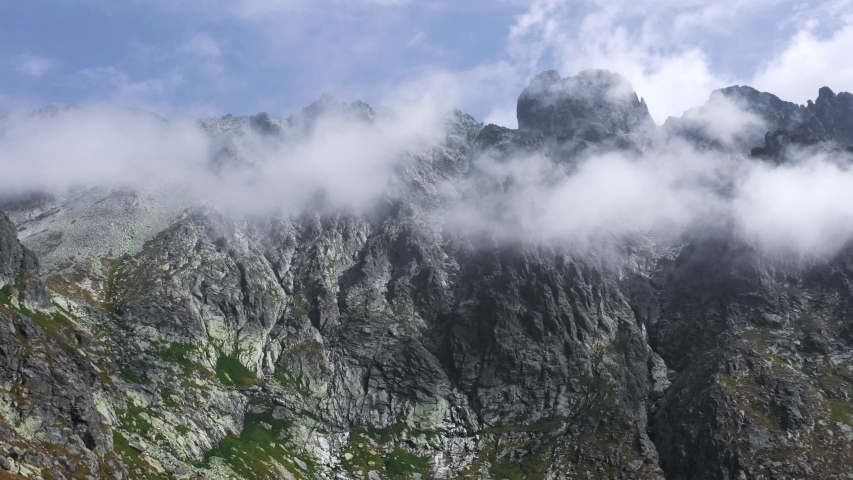 Aerial flight inside the Clouds at peaks in High Tatras Mountains in Slovakia