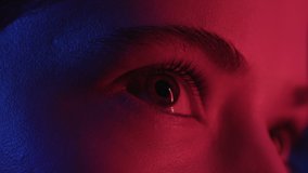 Woman Face with Open Eyes in Colourful Neon Light of Street Signs. Pretty Girl Looking Around in Modern Studio. Flickering Multi-Colour on Skin and Facial Features of Female. Close Shot of Urban Lady - Powered by Shutterstock - Get 15% off with code: PIKWIZARD15