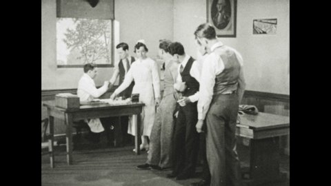 1940s: UNITED STATES: boys line up in clinic for shots. Doctor in TB clinic.