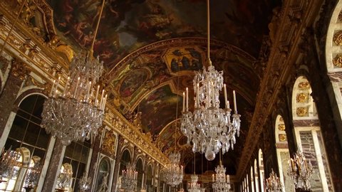 VERSAILLES, PARIS, FRANCE- February 12, 2020: Chandeliers in Hall of Mirrors, Palace of Versailles, Paris. Popular tourists attraction. Famous royal history landmark. 