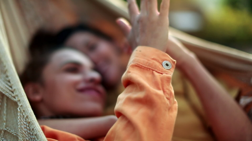Girlfriends joining hands together in the sunlight, unity and tolerance concept