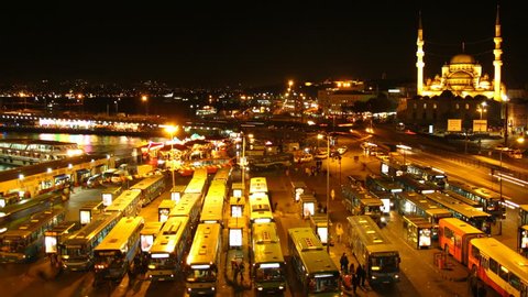 Time lapse Istanbul bus terminal at night with Mosque in background