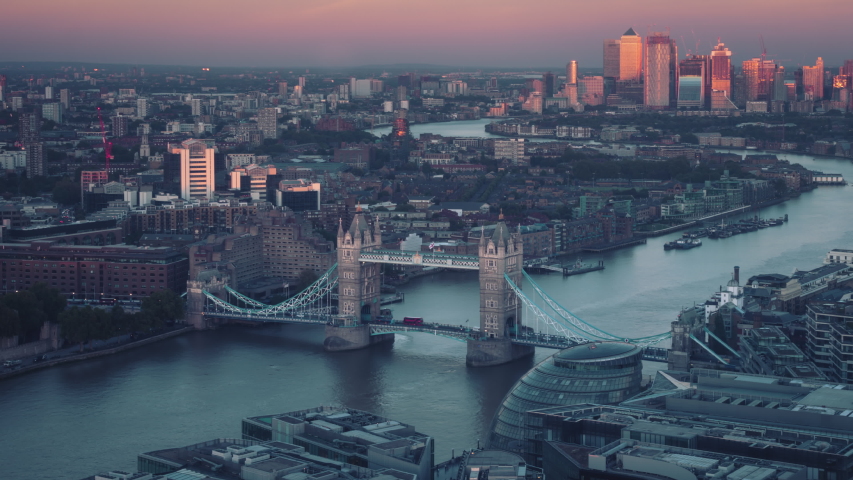 Time lapse London skyline with Tower bridge and Canary Wharf in sunset time, UK