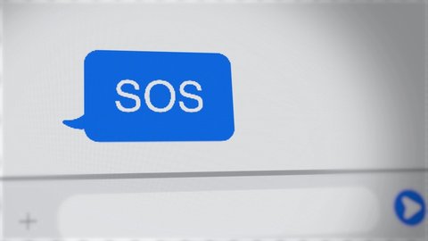 SOS message written on chat screen of computer or mobile phone