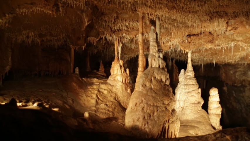 Moravian Karst. Stalactites, stalagmites and streak formations in cave of Balzarca. Czech Republic Royalty-Free Stock Footage #1048245232