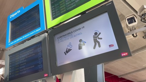 Bordeaux, France - March 2020 : Screens at Gare Saint-Jean railway station in Bordeaux showing the gestures to protect yourself from coronavirus in public transports during the epidemic disease