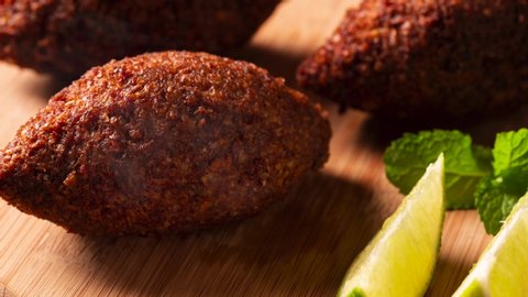 Kibbeh - Middle Eastern minced meat and bulghur wheat fried snack with smoke. Also popular party dish in Brazil (kibe)