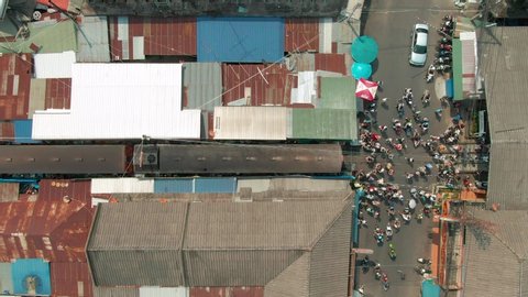 Maeklong Railway Market, Crowd at the end of the platform with Aerial view. Thailand.