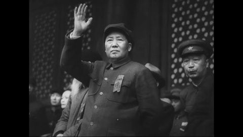 CIRCA 1950s - Chinese communist party leader Chairman Mao oversees a communist parade in Tiananmen Square, China.