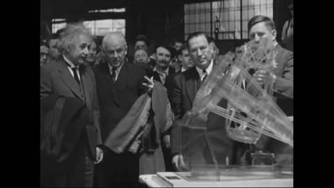 CIRCA 1940s - Newsreel footage shows Albert Einstein visiting an American defense plant.