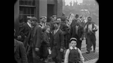 CIRCA 1901 - Coal miners are seen going to and from work at the Pendlebury Colliery in England.