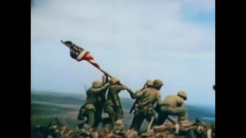 CIRCA 1945 - Iwo Jima iconic image of Marines soldiers raising the American flag in this patriotic world war two image.
