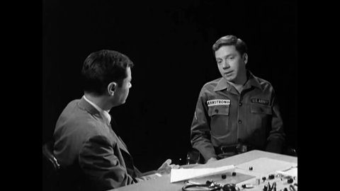 CIRCA 1960s - A Polygraph Examiner asks preliminary questions during a dry run of a test and the suspect in a robbery.