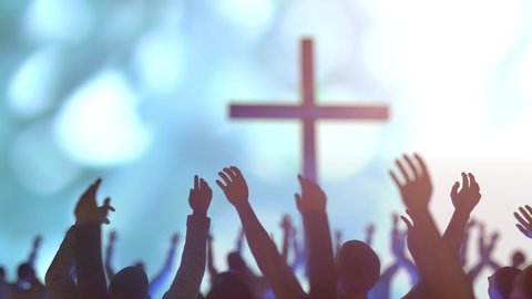 hands of a crowd of people at a Christian meeting during the  
glorification praise of God against the background of the cross 3d render