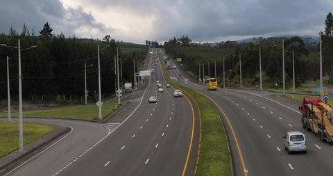 Highway traffic from an overpass on the Pan-American Highway, a wide section south of Quito, Ecuador