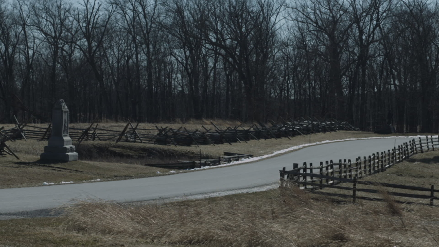Still shot of Gettysburg Battlefield in winter with high winds blowing tall grass