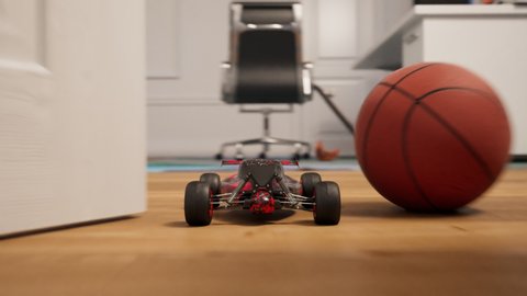 RC car indoor race. Miniature radio-controlled model of buggy driving fast in the house. An electric vehicle going through the corridors, kitchen and living room, riding on wooden floor and carpet 4K
