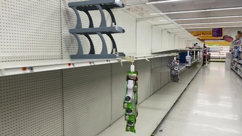Bethesda, Maryland / USA - March 14, 2020: Toilet paper, bread, rice, water and other non perishable foods are sold out at grocery stores across the country during the COVID-19 pandemic.