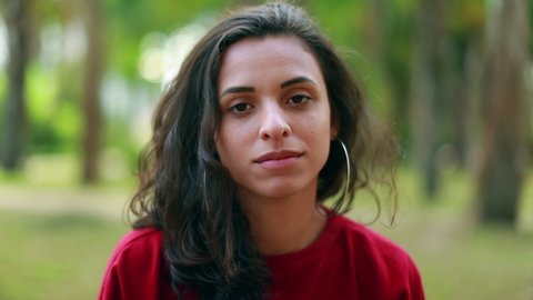 Portrait of latin american hispanic young woman face looking to camera