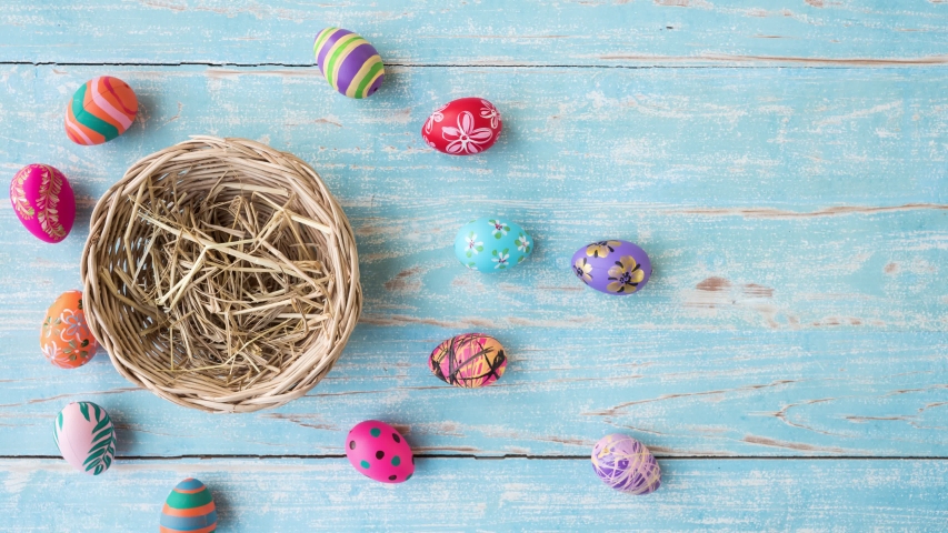 Easter eggs in basket, color plate and flower stop motion animation. Royalty-Free Stock Footage #1048347805