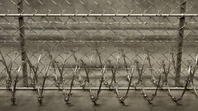 Climbing camera motion focusing on the fence of jail. Camera stops at the top and focuses on the wall with niche and letters of PRISON inside. Inmates isolation. Guards. Prison yard. Lost freedom.
 - Powered by Shutterstock - Get 15% off with code: PIKWIZARD15