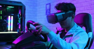 asian gamer play car racing game with wearing vr glasses