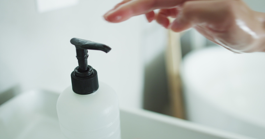 Corona virus travel prevention man showing hand hygiene washing hands with soap in hot water for coronavirus germs spreading protection. Using soap dispenser. Royalty-Free Stock Footage #1048399525