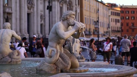 ROME, ITALY - AUG 4, 2019: Slow motion, fountain in Piazza Navona in Rome Italy. Steadicam shot. Romantic honeymoon travel destination. Tourism attraction landmark in Europe. 