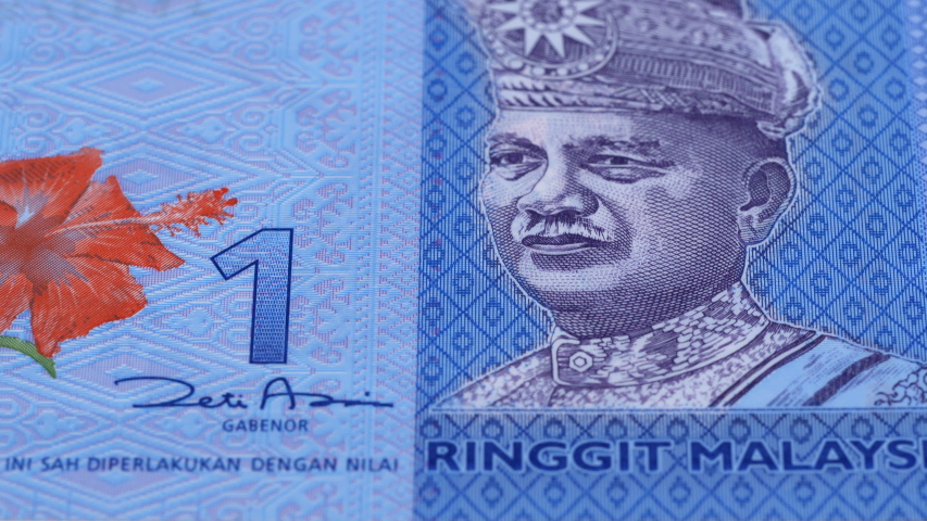 Malaysia ringgit banknotes fast tracking. malaysian money. slider shot,  macro. low angle, 4k