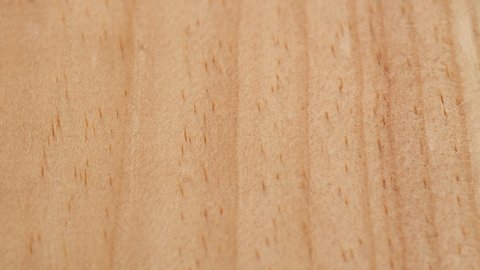 Flat wooden surface tracking. Wood texture. Dolly shot. Low angle, macro. 4K