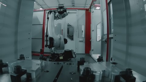 Industrial Robot Arm Starts Working at the Modern Factory, Grabs Steel Detail and Moves into Huge Machine, Finishes the Task, POV, Point of View, Gopro Camera, Close Up