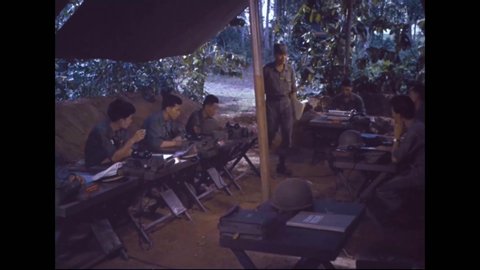 CIRCA 1962 - South Vietnamese soldiers in the Signal Corps are seen operating radios and telephone switchboards.