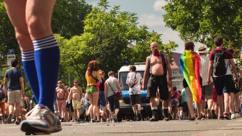 Berlin, Germany. July 27th 2019: 
Crowd at Gay Pride parade in the Street. Berlin. Time Lapse. Zoom In