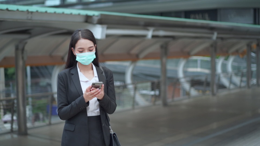 woman walking wearing face mask against air pollution, coronavirus and flu virus. coughing and sneeze  in the city streets