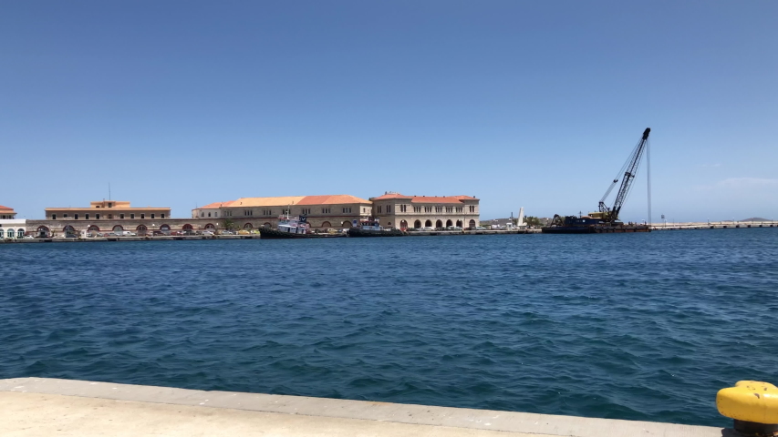 The port of Ermoupolis port in Syros island, Greece, with blue sea and sky.